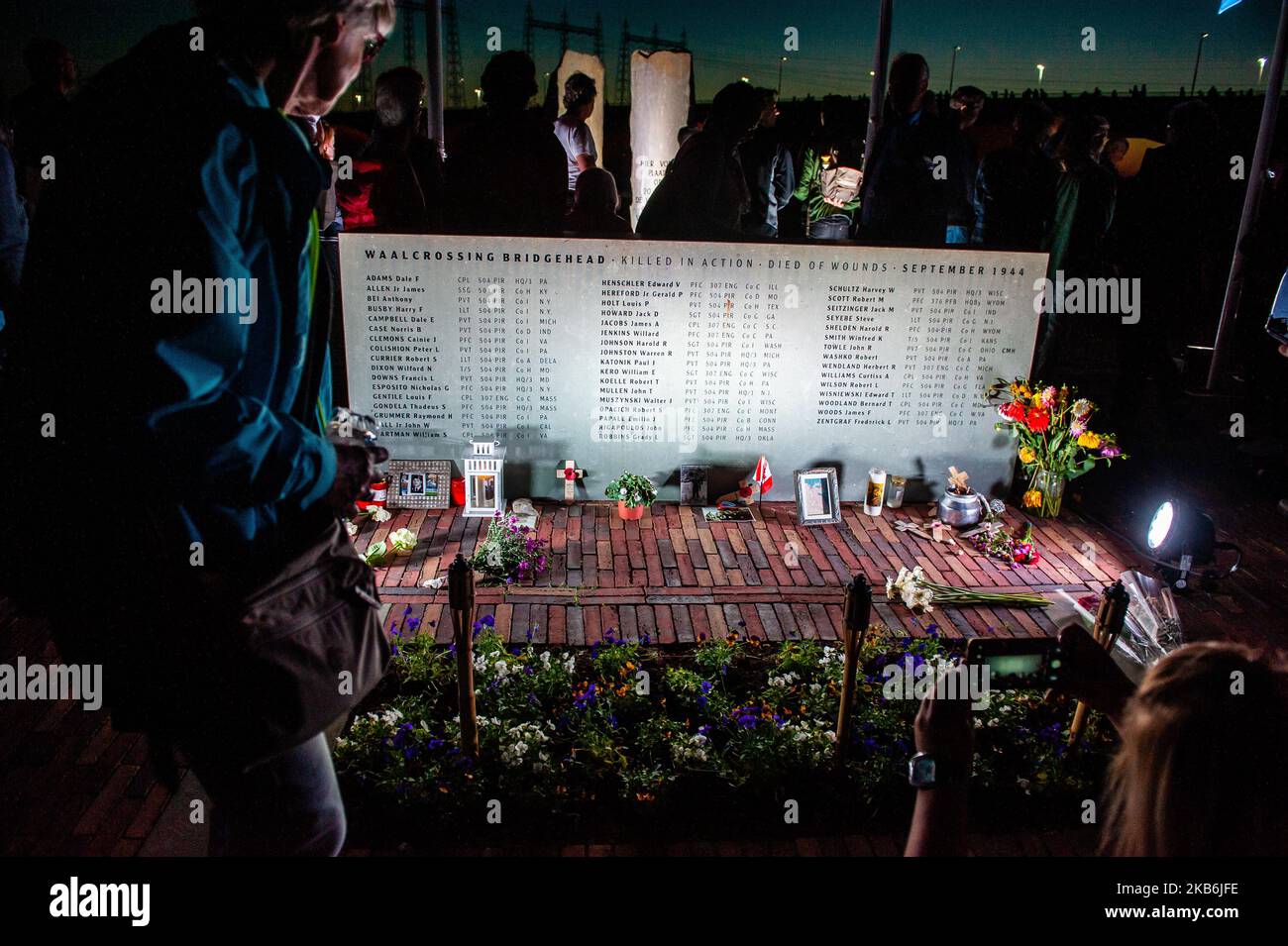 This year, 75 years after Operation Market Garden, the Dutch city of Nijmegen celebrate 75 Years of freedom, in Nijmegen, Netherlands, on September 21, 2019. During this Sunset March, they gave special attention to the 48 allied soldiers who died 75 years ago during the heroic crossing of the Waal river. 48 light towers turned on and at the same time, 48 light rays illuminated the sky. This tribute to them was supported by an opera spectacle from the water. The Sunset March ends at the Waalcrossing monument, where people could leave flowers. (Photo by Romy Arroyo Fernandez/NurPhoto) Stock Photo