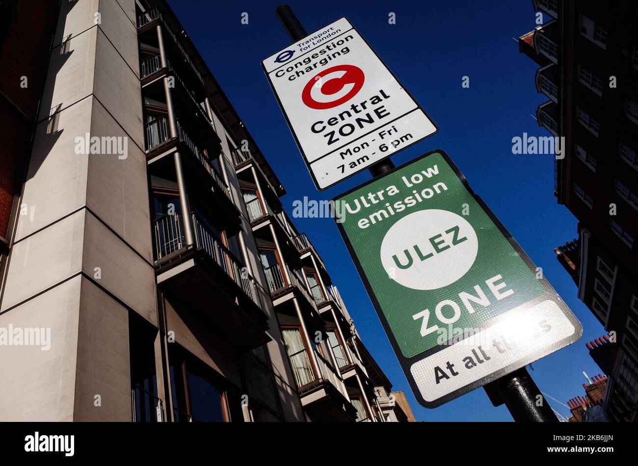 Signs for the central London Congestion Charging Zone (CCZ) and Ultra Low Emission Zone (ULEZ) stand on Upper Brook Street in London, England, on September 21, 2019. (Photo by David Cliff/NurPhoto) Stock Photo