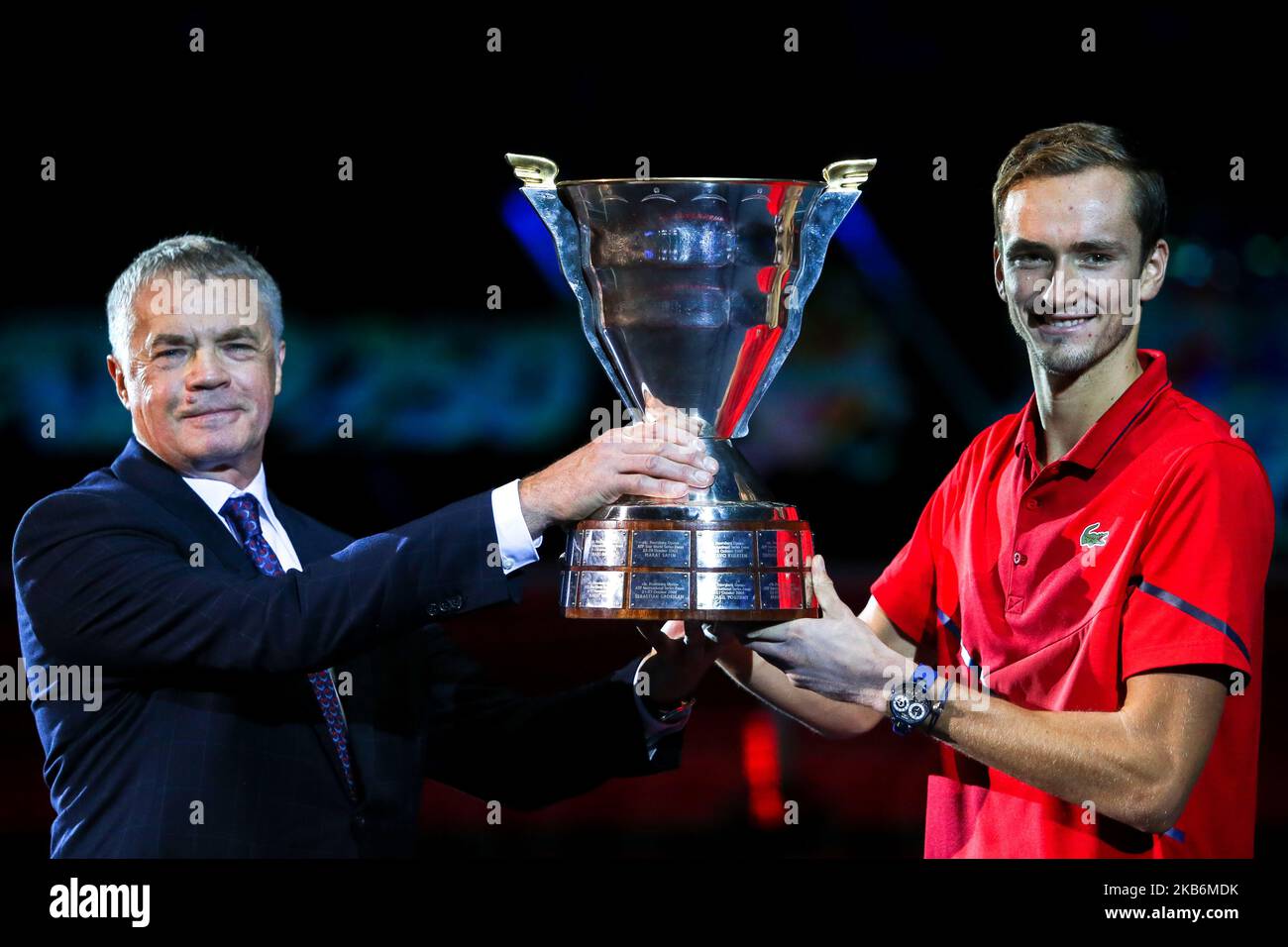 Daniil Medvedev of Russia, right, poses after winning the final