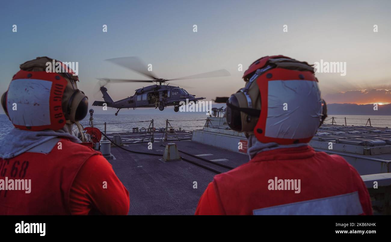 221031-N-EB711-2002 GULF OF AQABA (October 31, 2022) A U.S. Air Force HH-60 Pave Hawk helicopter conducts flight operations aboard the guided-missile destroyer USS The Sullivans (DDG 68), Oct. 31. The Sullivans is deployed to the U.S. 5th Fleet area of operations to help ensure maritime security and stability in the Middle East region. (U.S. Navy photo by Sonar Technician (Surface) 1st Class Kevin Frus) Stock Photo