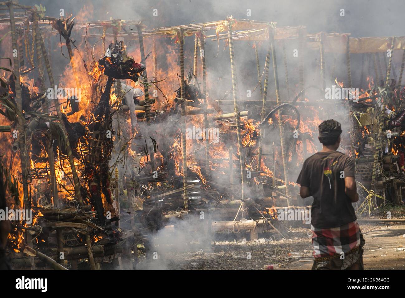 Coffin in shape of mythical dragon and bull being burnt during mass cremation or locally called Ngaben rituals in the grave yard of Bayad Village in Tegallalang, Gianyar, Bali on September 25, 2019. A total of 59 bodies in the form of human skeletons that died several years ago were cremated simultaneously in order to ease the cost of the ceremony for local residents. (Photo by Johanes Christo/NurPhoto) Stock Photo