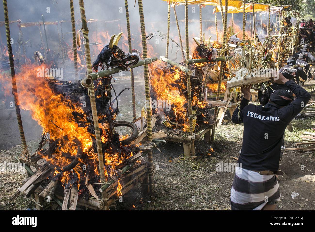 Coffin in shape of mythical dragon and bull being burnt during mass cremation or locally called Ngaben rituals in the grave yard of Bayad Village in Tegallalang, Gianyar, Bali on September 25, 2019. A total of 59 bodies in the form of human skeletons that died several years ago were cremated simultaneously in order to ease the cost of the ceremony for local residents. (Photo by Johanes Christo/NurPhoto) Stock Photo