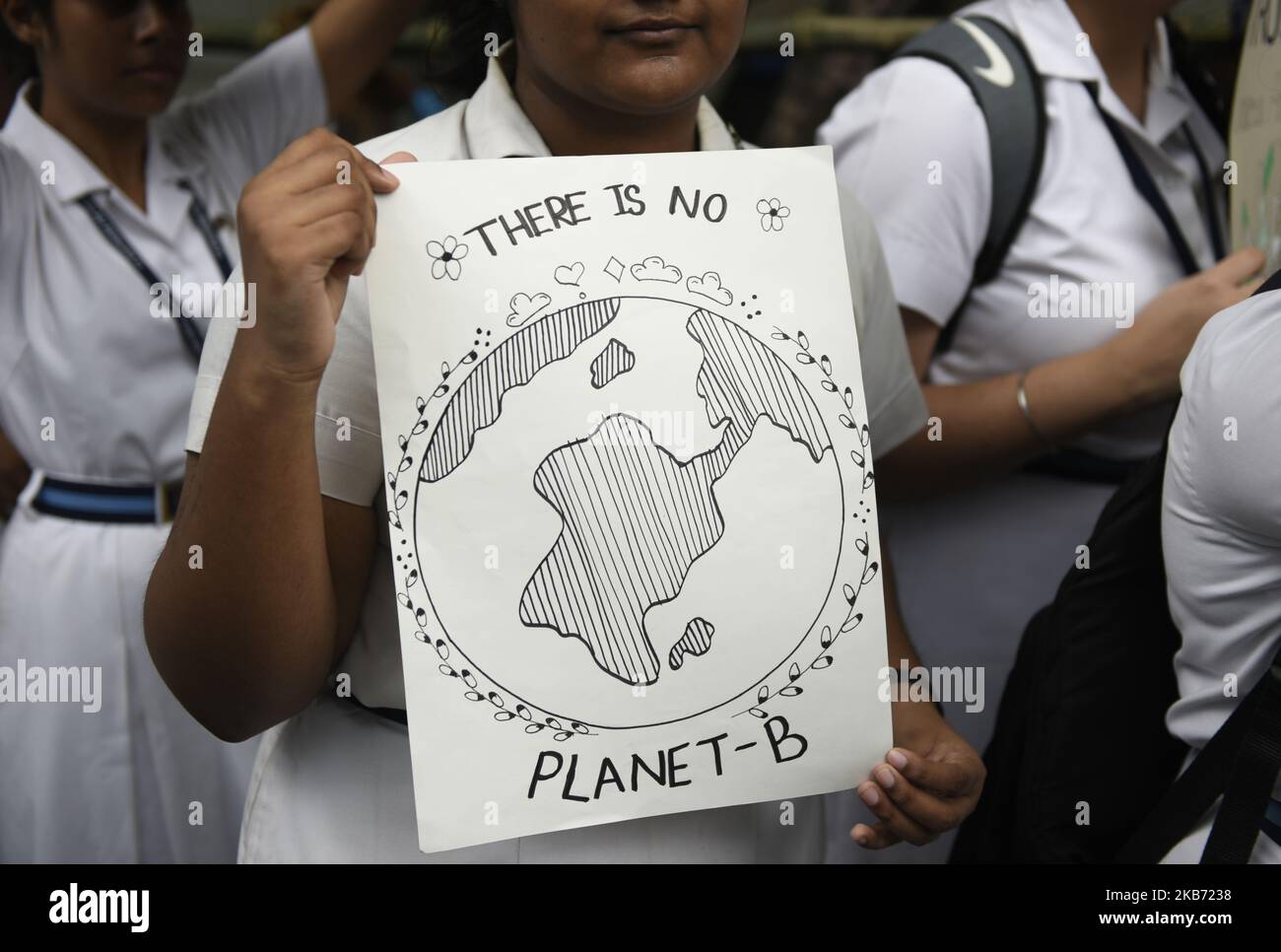 School students, Local Citizens, Environmental Activists shout slogans as they participate in a global climate strike to protest against governmental inaction towards climate breakdown and environmental pollution, part of demonstrations being held worldwide in a movement dubbed 'Fridays for Future', Kolkata, India, September 27, 2019. (Photo by Indranil Aditya/NurPhoto) Stock Photo