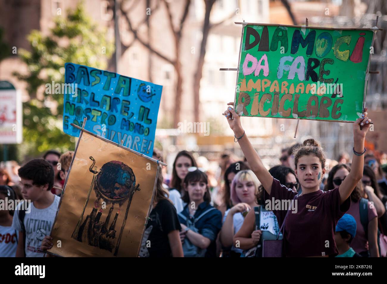 Students demonstrate during a worldwide protest demanding action on climate change, in Rome, Friday, Sept. 27, 2019. The protests are inspired by Swedish teenager Greta Thunberg, who spoke to world leaders at a United Nations summit this week. Writing on banner reads in Italian' "Change the system, not the climateon. September 27, 2019 in Rome, Italy. (Photo by Andrea Ronchini/NurPhoto) Stock Photo