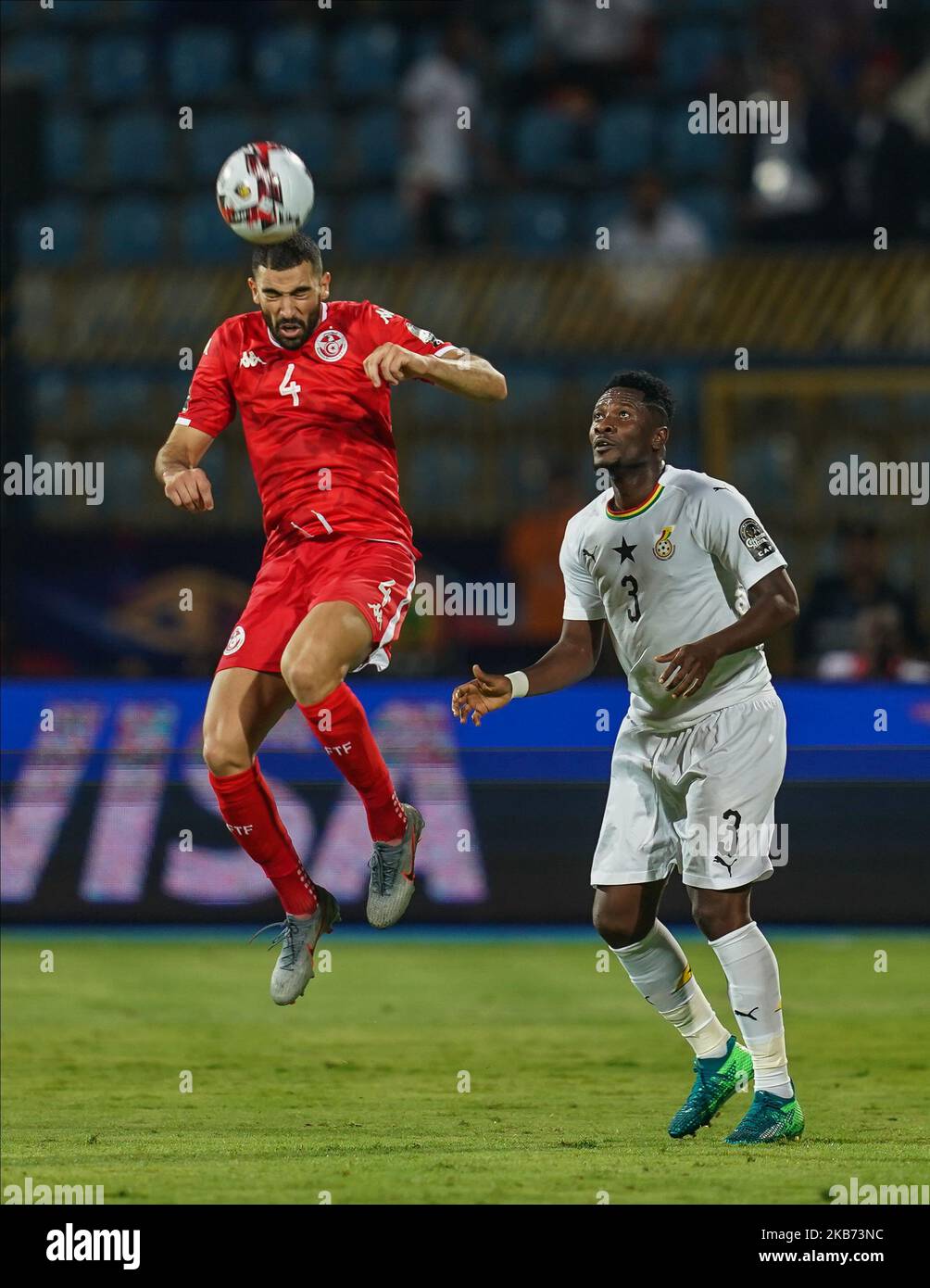 Yassine Meriah of Tunisia and Asamoah Gyan of Egypt during the 2019 African Cup of Nations match between Ghana and Tunisia at the Ismailia Stadium in Ismailia, Egypt on July 8,2019. (Photo by Ulrik Pedersen/NurPhoto) Stock Photo