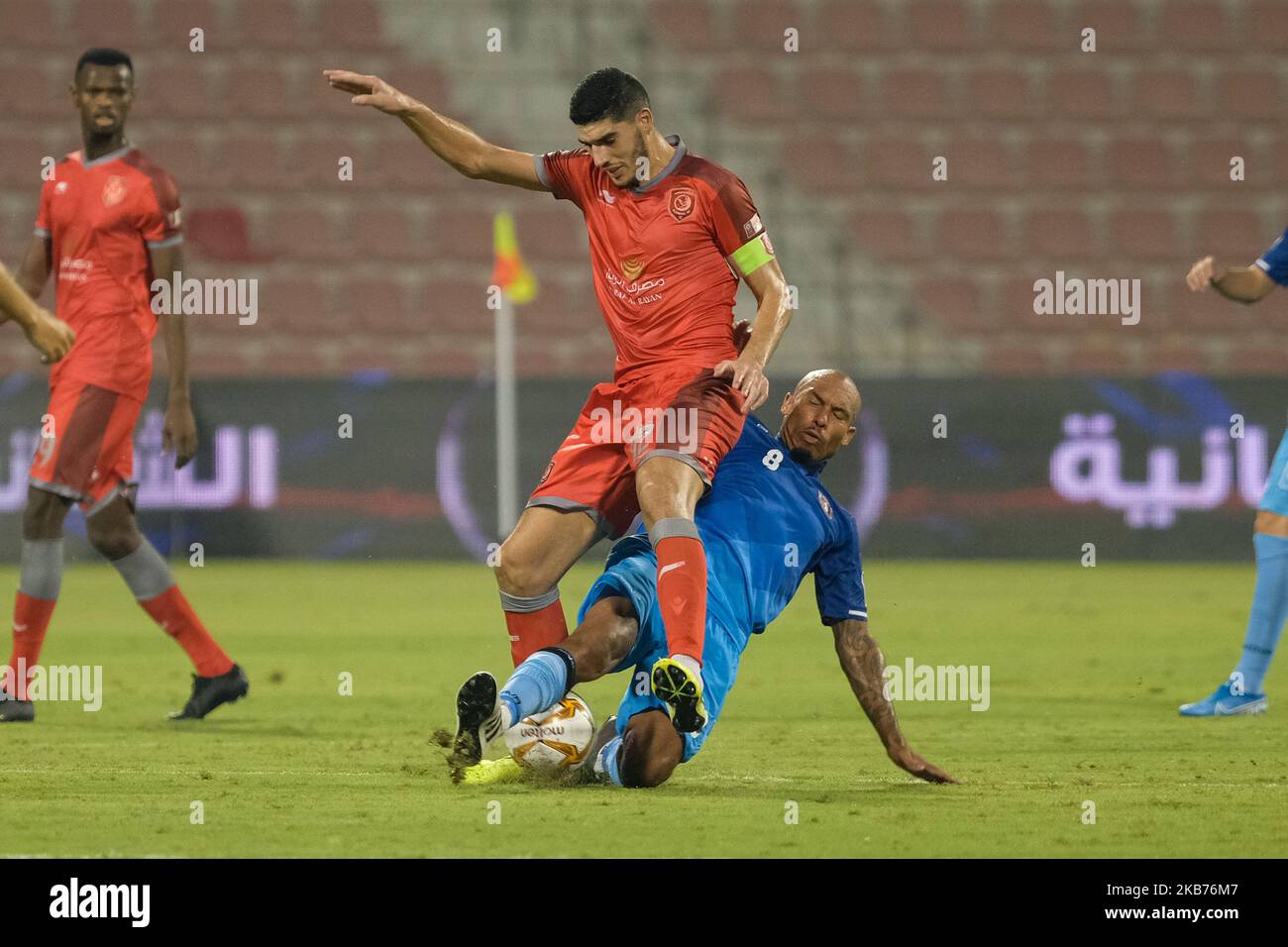 Al Shahaniya's Nigel de Jong tackles Karim Boudiaf during a Qatar Stars League match against Al Duhail at the Grand Hamad Stadium, Doha, Qatar on 28 September 2019. (Photo by Simon Holmes/NurPhoto) Stock Photo