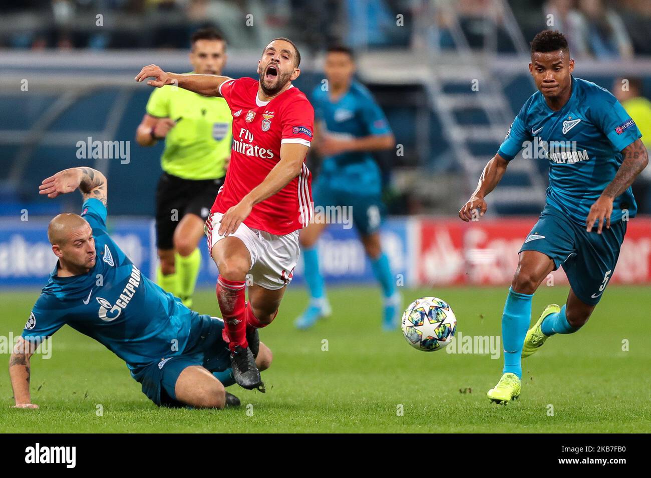 Yaroslav Rakits'kyy (L) and Wílmar Barrios of FC Zenit Saint Petersburg and Adel Taarabt (C) of SL Benfica vie for the ball during the UEFA Champions League group G match between FC Zenit St. Petersburg and SL Benfica at the Saint Petersburg Stadium on October 01, 2019 in St.Petersburg, Russia. (Photo by Igor Russak/NurPhoto) Stock Photo