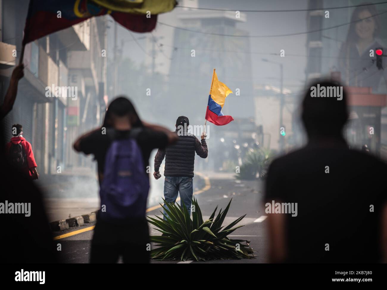 Protestors and Riot police chase during a transport strike against the economic policies of the government of Ecuadorean President Lenin Moreno regarding the agreement signed on March with the International Monetary Fund (IMF), in Quito, on October 4, 2019. (Photo by Rafael Rodriguez/NurPhoto) Stock Photo