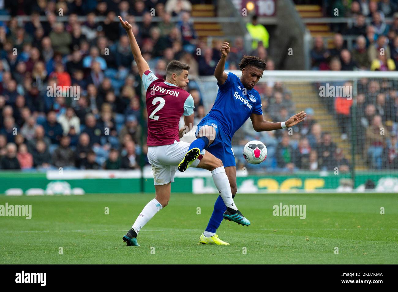 Alex Iwobi of Everton battles with Matthew Lowton of Burnley during the Premier League match between Burnley and Everton at Turf Moor, Burnley on Saturday 5th October 2019. (Credit: Pat Scaasi | MI News) Photograph may only be used for newspaper and/or magazine editorial purposes, license required for commercial use (Photo by MI News/NurPhoto) Stock Photo