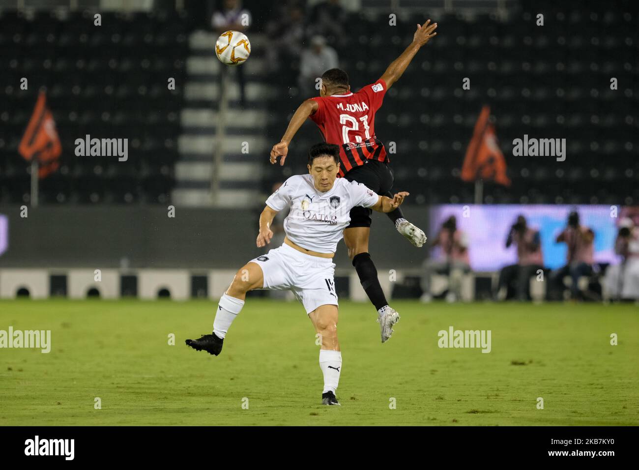 Nam Tae-hee wins a header against Mohammed Al-Alawi during Qatar Stars League match between Al Sadd and Al Rayyan on October 5 2019 at the Jassim Bin Hamad stadium in Doha, Qatar. Final result: Al Sadd 2-4 Al Rayyan (Photo by Simon Holmes/NurPhoto) Stock Photo