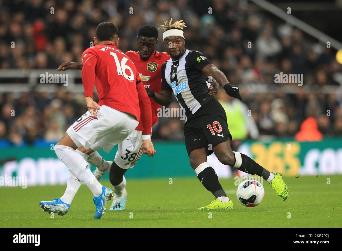 Allan Saint-Maximin of Newcastle United in action with Marcos Rojo and Axel Tuanzebe during the Premier League match between Newcastle United and Manchester United at St. James's Park, Newcastle on Sunday 6th October 2019. (Photo by Mark Fletcher/MI News/NurPhoto) Stock Photo