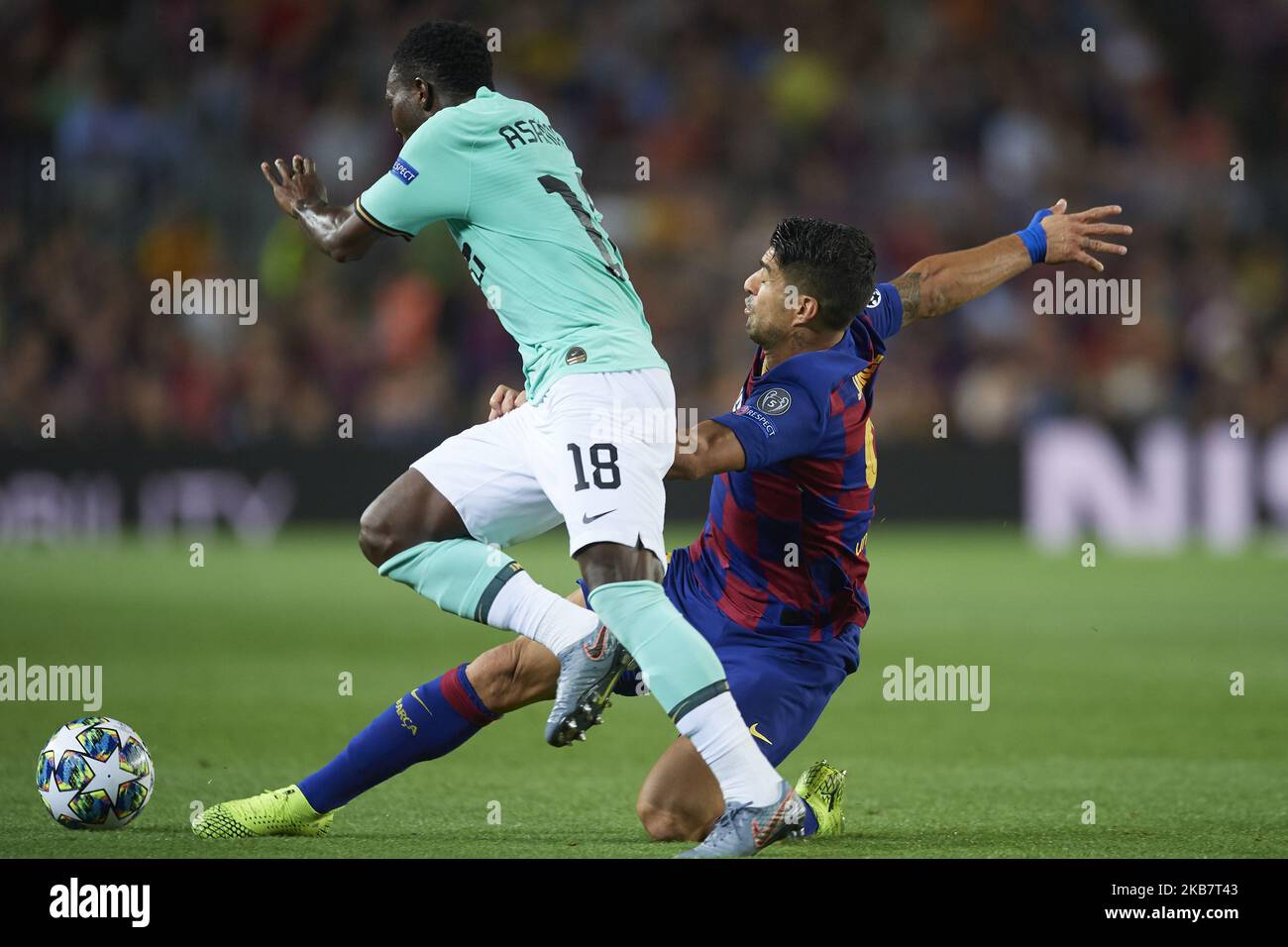 Luis Suarez of Barcelona and Kwadwo Asamoah of Inter of Milan compete for the ball during the UEFA Champions League group F match between FC Barcelona and Inter at Camp Nou on October 2, 2019 in Barcelona, Spain. (Photo by Jose Breton/Pics Action/NurPhoto) Stock Photo