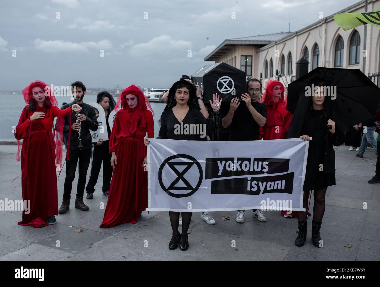 Extinction Rebellion Turkey organized a demonstration on October 7, 2019 in Istanbul for the representation of species that are on the verge of extinction. The protest included a reference to the Red Brigade, and the demonstrators carried a black coffin, symbolizing the extinct species. Extinction Rebellion is a socio-political movement around the world with the stated aim of using civil disobedience and nonviolent resistance to compel government action on climate breakdown, biodiversity loss, and the risk of social and ecological collapse. (Photo by Erhan Demirtas/NurPhoto) Stock Photo