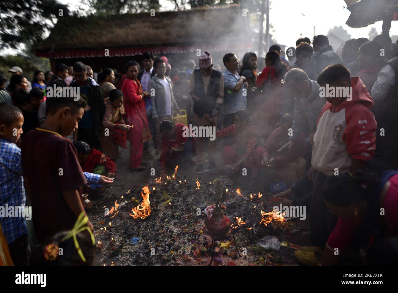 Nepalese devotees offering fragrances sticks traditional instruments
