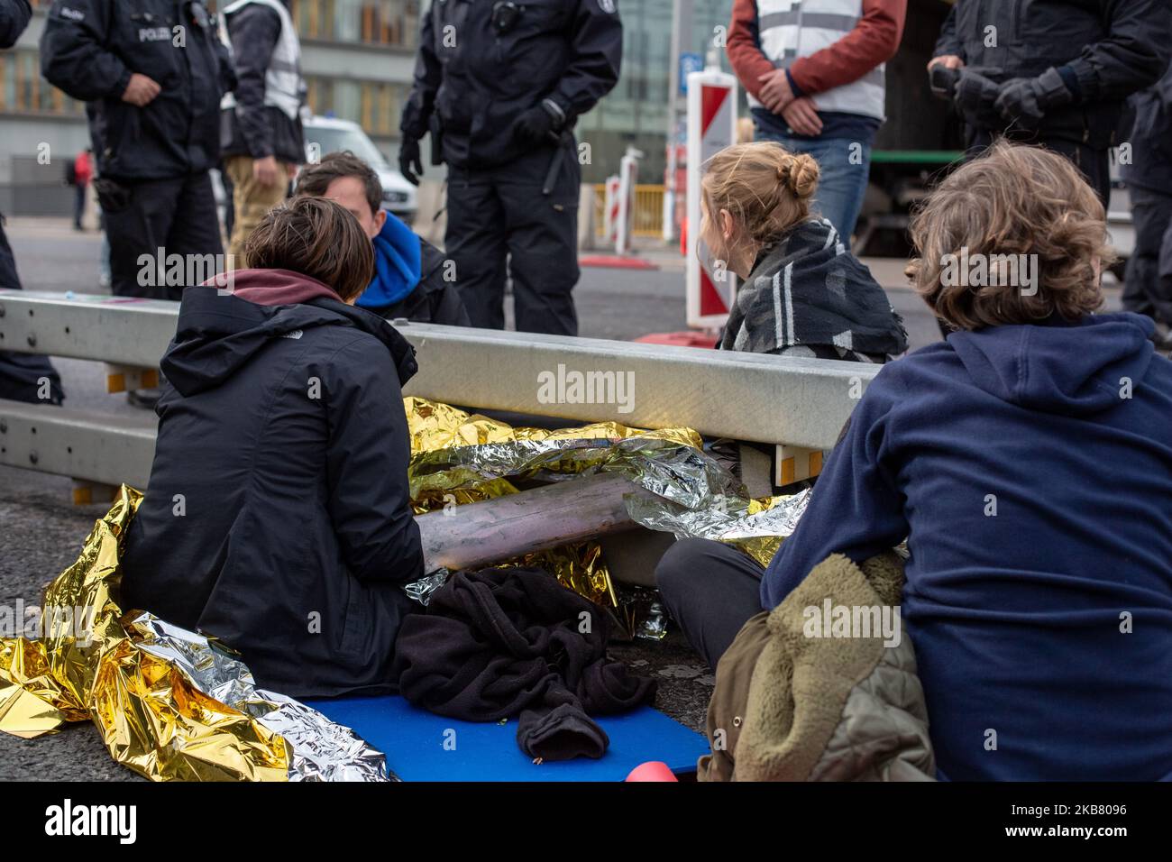 For three days now, the activists of Extinction Rebellion have been blocking streets in Berlin. Hundreds follow the call for occupation of the Berlin Victory Column, The Potsdamer Platz, as well as bridges located in the city center. The actions restrict far fewer Berliners as expected by the movement. One thing is remarkable about these protests, the peaceful manners between police and demonstrators - evidently a well thought strategy by the XR de-escalation team. The movement demands 'the immediate declaration of climatic emergency,' 'Drastic measures to combat climate change,' and 'Genuine  Stock Photo