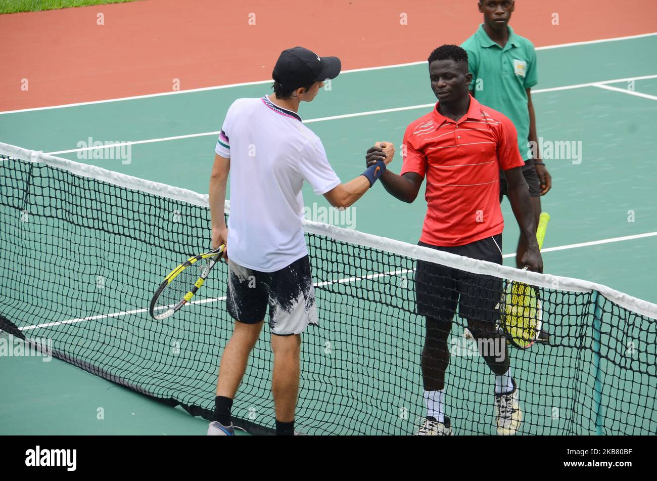 Alexey Dubinin (RUS) shake hands with Augustine Stephen (NGA) during their 1R Qualifying matchs at Lagos Open 2019 on 7th October 2019 in Lagos, Nigeria. (Photo by Olukayode Jaiyeola/NurPhoto) Stock Photo