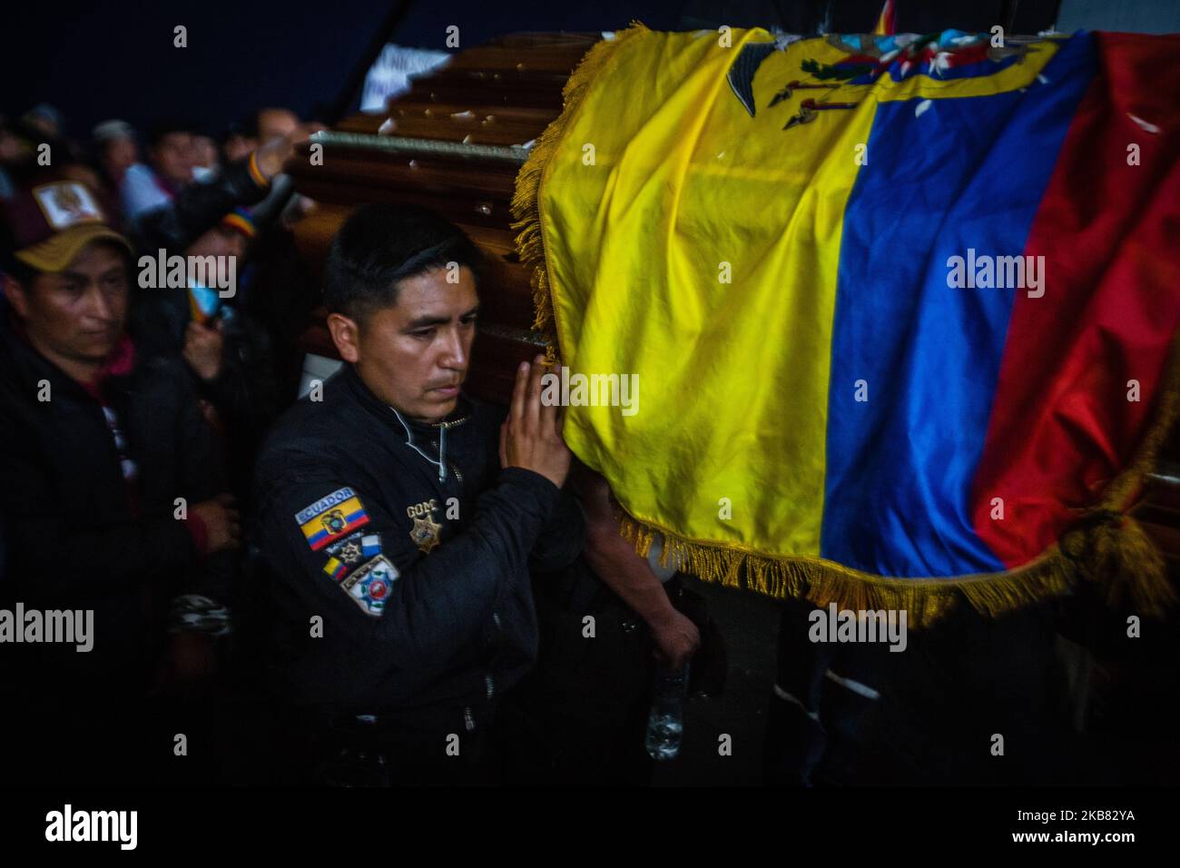 A coffin of the Indigenous people killed by the Ecuadorian Police arrived at the Casa De la Cultura Ecuatoriana, in Quito, Ecuador, on 10 October 2019, the same one that has served as accommodation for the indigenous community members. As a rule of punishment, the police retained by this community punished the murderers by having them carry the feretos. (Photo by Rafael Rodriguez/NurPhoto) Stock Photo