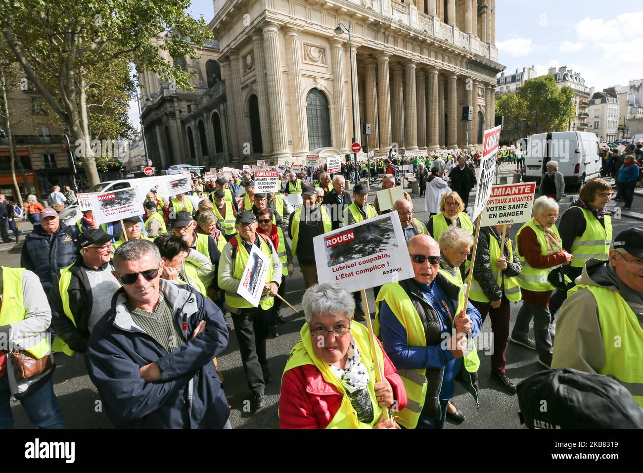 People take part in Paris on October 11, 2019 in a demonstration called by the National Association for the Defense of Victims of Asbestos (ANDEVA), few weeks after a massive fire ravaged a chemical factory in Rouen and residents find pieces of fiber ciment with asbestos in their garden. (Photo by Michel Stoupak/NurPhoto) Stock Photo