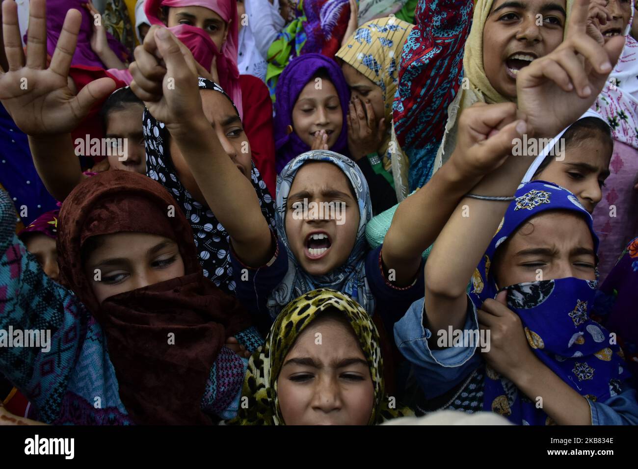Kashmiri girls protest after Friday prayers in Srinagar, Indian Administered Kashmir on 10 October 2019. Shutdown continues in Kashmir valley on 68th day after government of India Stripped statehood of Jammu and Kashmir. People were demanding the re-implementation of Article 370 which gave special status to the people of Jammu and Kashmir. (Photo by Muzamil Mattoo/NurPhoto) Stock Photo