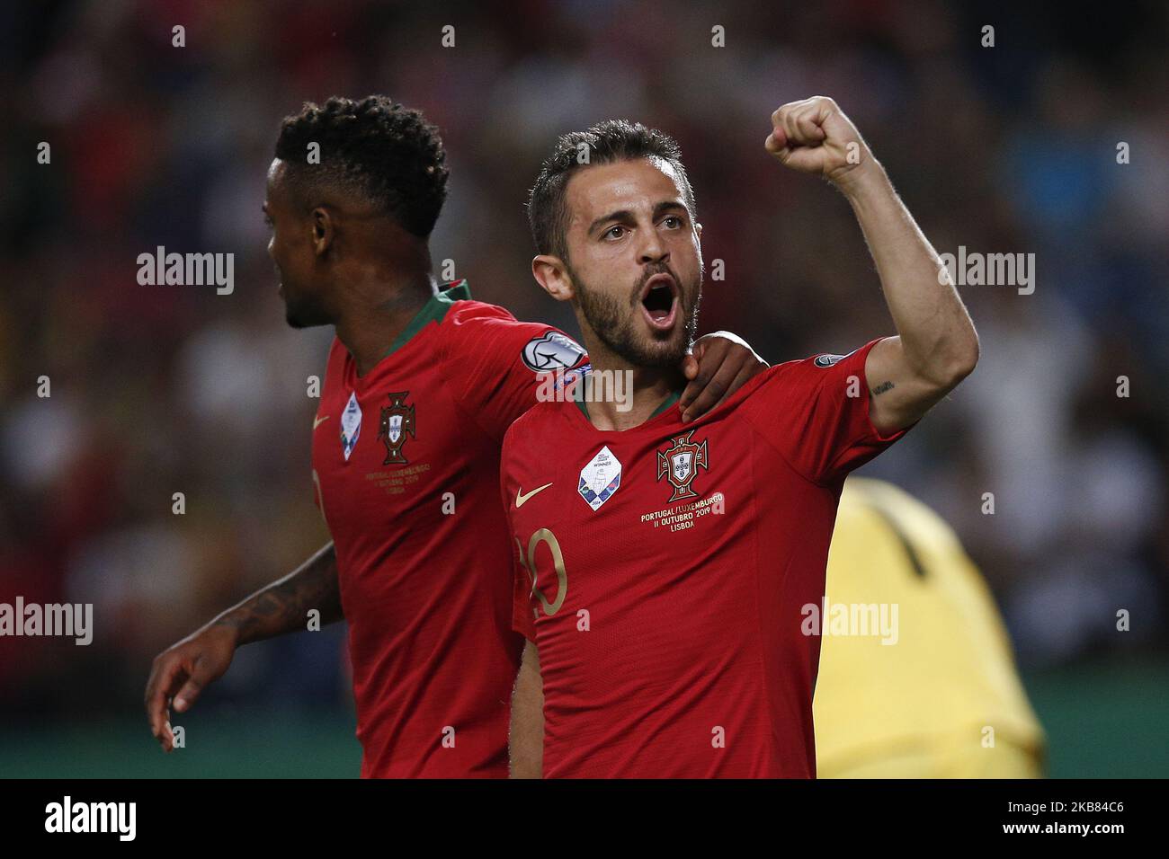Bernardo Silva of Portugal (R) celebrates his goal with Nelson Semedo of Portugal (L) during the Euro 2020 qualifying match football match between Portugal v Luxembourg, in Lisbon, on October 11, 2019. (Photo by Carlos Palma/NurPhoto) Stock Photo