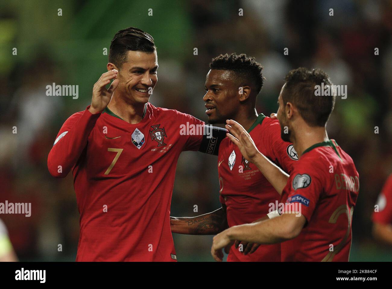 Bernardo Silva of Portugal (R) celebrates his goal with Nelson Semedo of Portugal (C) and Cristiano Ronaldo of Portugal (L) during the Euro 2020 qualifying match football match between Portugal v Luxembourg, in Lisbon, on October 11, 2019. (Photo by Carlos Palma/NurPhoto) Stock Photo