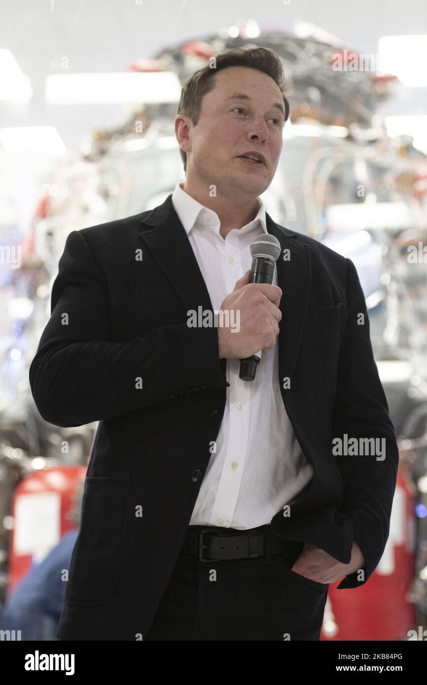 SpaceX Chief Engineer Elon Musk speaks in front of Crew Dragon