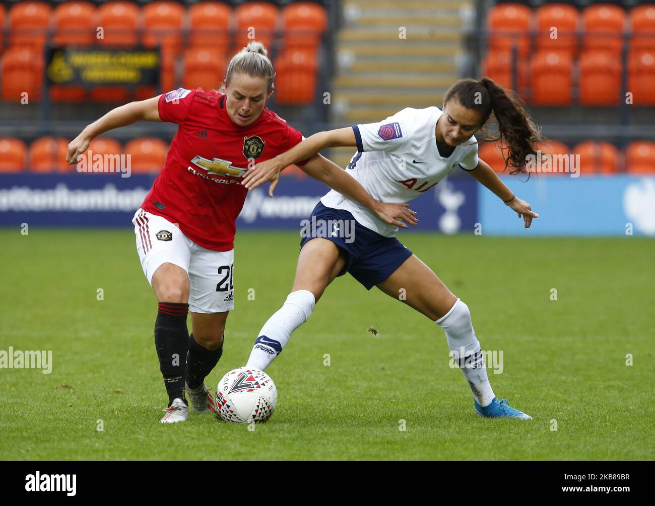 L-R Kirsty Smith of Manchester United Women tussle with Rosella Ayane ...