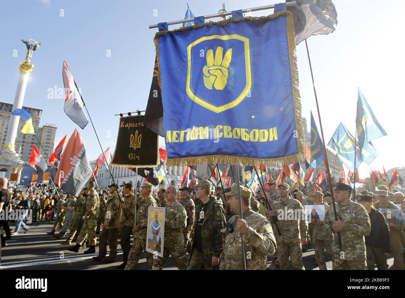 Ukrainians take part at a march to the 77th anniversary of the founding of the Ukrainian Insurgent Army in central Kiev, Ukraine, on 14 October, 2019. Thousands activists of different nationalist parties and movements marched in the center of Ukrainian capital celebrating the founding of the Ukrainian Insurgent Army and Defender of Ukraine Day. The Ukrainian Insurgent Army or UPA fought for Ukrainian independence against the Red Army and the Nazi wermacht during the WWII. (Photo by STR/NurPhoto) Stock Photo