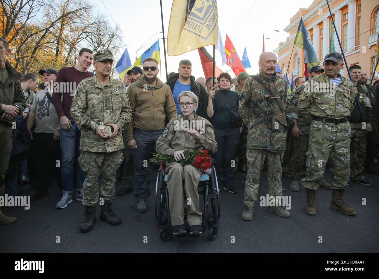 Veteran and lawmaker Yana Zinkevych (on a wheelchair) attends a rally in Kyiv, Ukraine, October 14, 2019. Several Thousand Ukrainians attend the March Against Capitulation and Surrender of State Interests on October 14, when Ukraine marks the Day of Defender. (Photo by Sergii Kharchenko/NurPhoto) Stock Photo