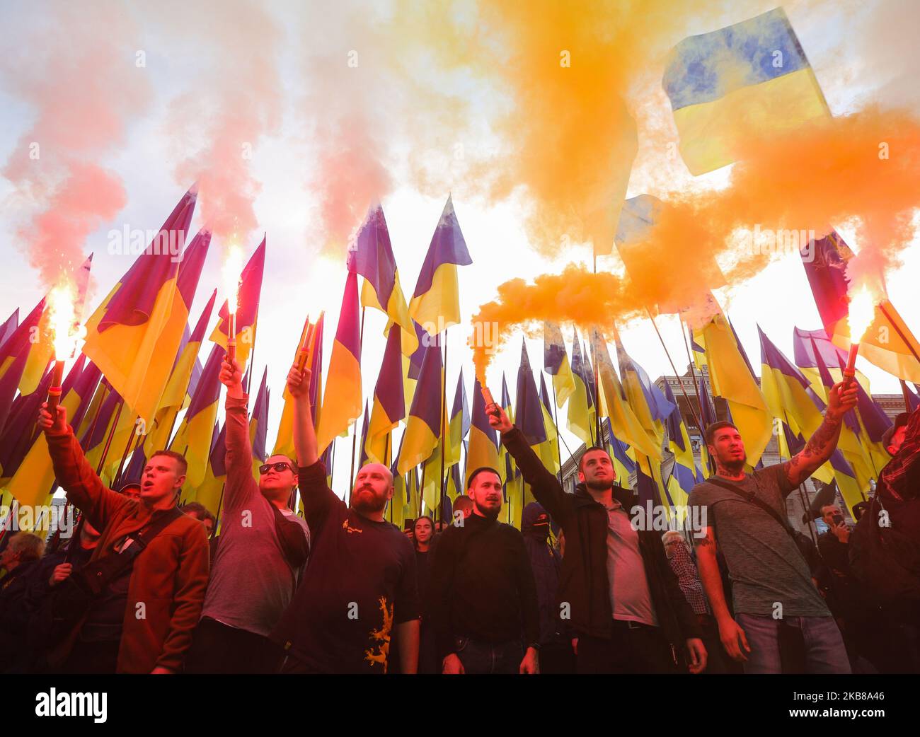 Men in uniforms lit flares during a rally against surrender in Kyiv, Ukraine, October 14, 2019. Several Thousand Ukrainians attend the March Against Capitulation and Surrender of State Interests on October 14, when Ukraine marks the Day of Defender. (Photo by Sergii Kharchenko/NurPhoto) Stock Photo