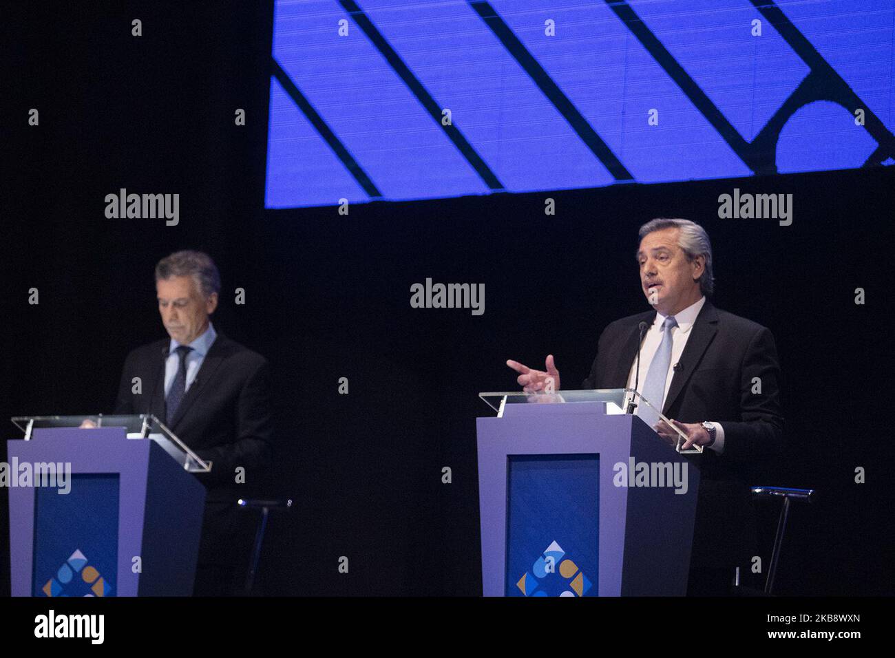 Mauricio Macri, Argentina's president, left, listens while Alberto Fernandez, presidential candidate for Frente de Todos party, speaks during a presidential candidate debate in Buenos Aires, Argentina, on Sunday, Oct. 20, 2019. (Photo by MatÃas Baglietto/NurPhoto) Stock Photo