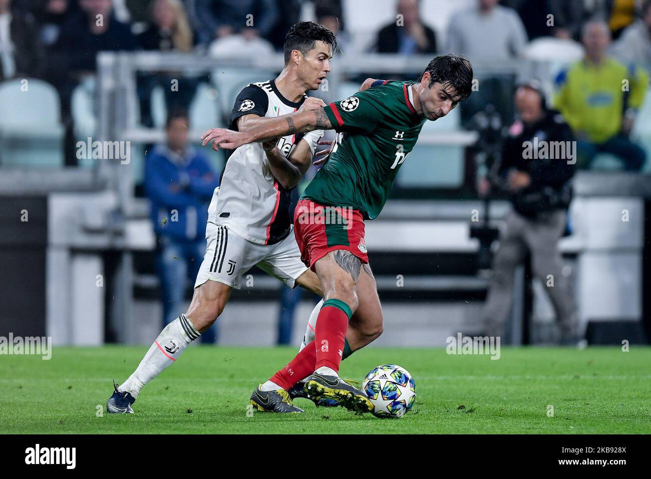 Cristiano Ronaldo of Juventus is challenged by Vedran Corluka of Lokomotiv Moscow during the UEFA Champions League group stage match between Juventus and Lokomotiv Moscow at the Juventus Stadium, Turin, Italy on 22 October 2019. (Photo by Giuseppe Maffia/NurPhoto) Stock Photo