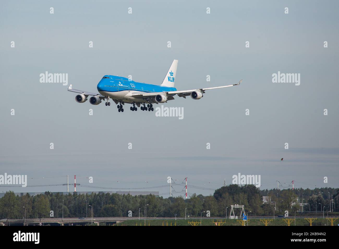 KLM Royal Dutch Airlines Boeing Jumbo Jet 747-400M airplane as seen on final approach landing, touch down and rubber smoke at Polderbaan runway 18R/36L from the landing gear wheels at Amsterdam Schiphol International Airport AMS EHAM in the Netherlands on 16 October 2019. The wide-body, heavy, long-haul 747 or B744 aircraft has the registration PH-BFT, the name Tokyo / City of Tokyo, has a 4x GE CF6-80 engines and a 100 years anniversary logo sticker on the fuselage. The airliner is a mixed passenger and Freight or Combi variant. KLM KL Koninklijke Luchtvaart Maatschappij airline is the flag c Stock Photo