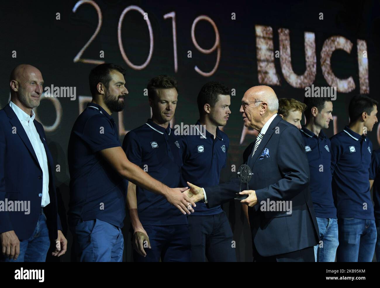 Members of Deceuninck–Quick-Step, a Belgian UCI WorldTeam cycling team, receive an Award for 2019 UCI World Ranking Best Team, from Artur Lopes, President of the UCI Remuneration Commission and Vice-President of the Portuguese National Olympic Committee, seen during the 5th UCI Cycling Gala in Guilin. On Tuesday, October 22, 2019, in Guilin, Guangxi Region, China. (Photo by Artur Widak/NurPhoto) Stock Photo