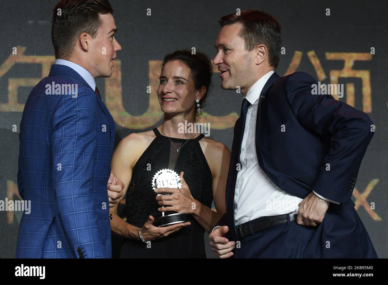 (L-R) Mads Pedersen (Denmark/Team Trek–Segafredo) and Marianne Vos (Netherland/Team CCC Liv), and David Lappartient, the President of the Union Cycliste Internationale (UCI), seen during the 5th UCI Cycling Gala in Guilin. On Tuesday, October 22, 2019, in Guilin, Guangxi Region, China. (Photo by Artur Widak/NurPhoto) Stock Photo