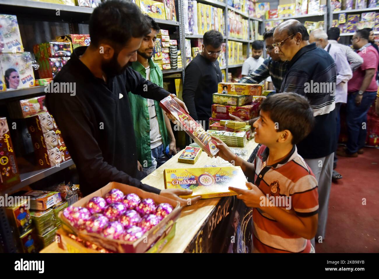 People buys fire cracker from a temporary fire cracker market on the