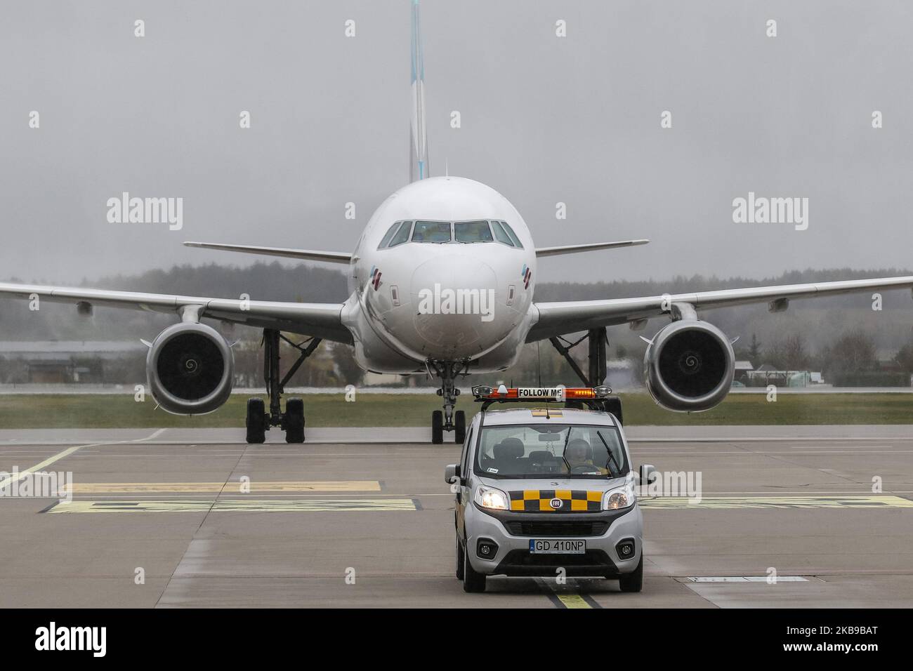 Eurowings (Lufthansa group) Airbus A319-132 (reg. No. D-AGWU) taxiing at Gdansk Lech Walesa Rebiechowo GDN airport following a 'Follow me' Fiat Qubo car is seen in Gdansk, Poland on 27 October 2019 Eurowings lines inaugurated Gdansk - Dusseldorf (Germany) route, and will operate on it 4 times weekly. (Photo by Michal Fludra/NurPhoto) Stock Photo