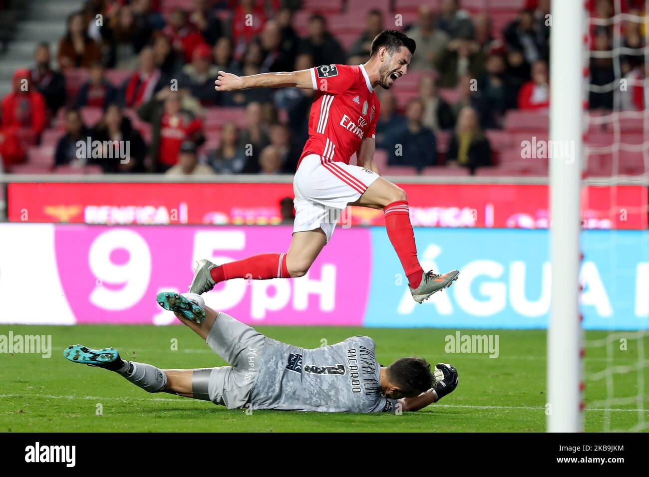 Pizzi of SL Benfica (up) vies with Ricardo Ferreira of Portimonense SC during the Portuguese League football match between SL Benfica and Portimonense SC at the Luz stadium in Lisbon, Portugal on October 30, 2019. (Photo by Pedro FiÃºza/NurPhoto) Stock Photo
