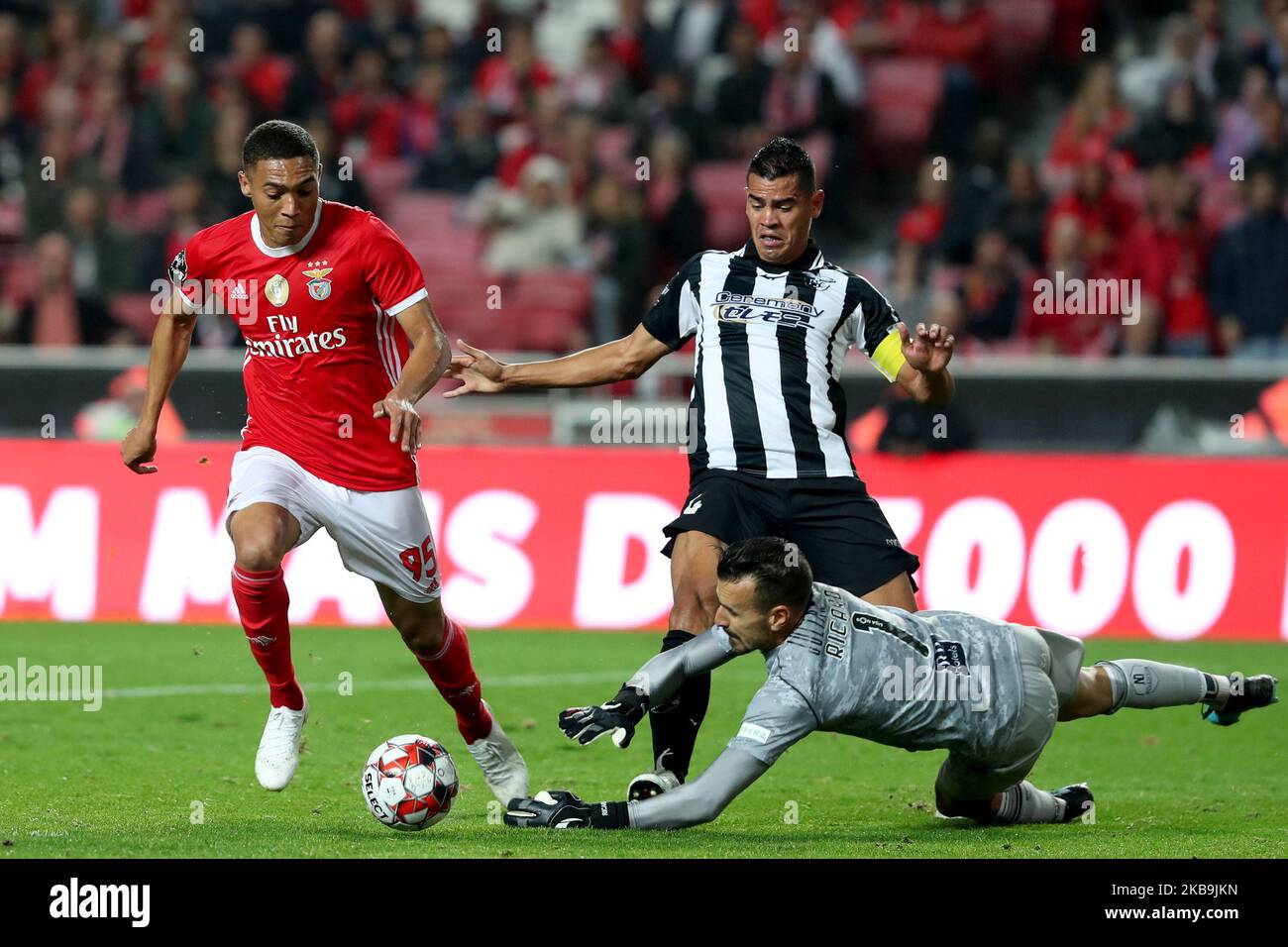 Vinicius of SL Benfica (L) vies with Jadson (C ) and Ricardo Ferreira of Portimonense SC (R ) during the Portuguese League football match between SL Benfica and Portimonense SC at the Luz stadium in Lisbon, Portugal on October 30, 2019. (Photo by Pedro FiÃºza/NurPhoto) Stock Photo
