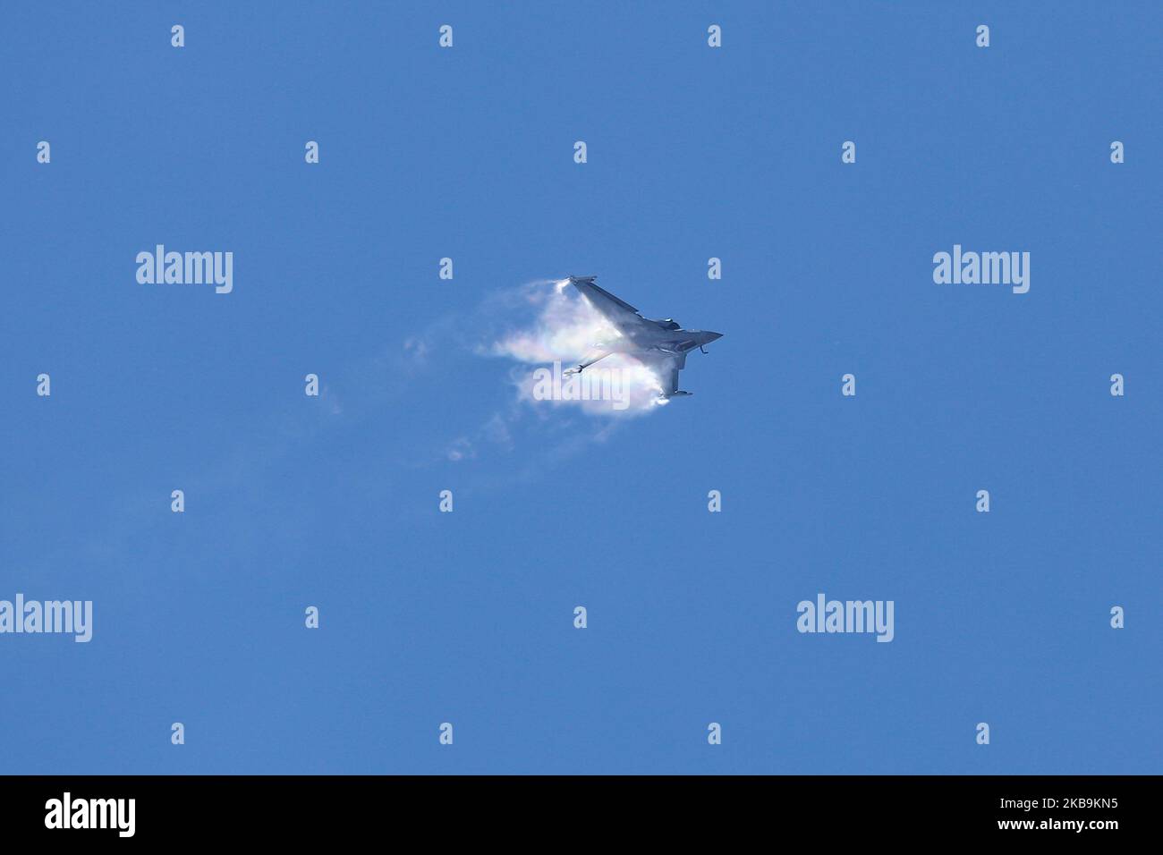 Sonic Boom of a Dassault Rafale multirole fighter jet aircraft of the French Air Force, Armee De L'Air, performs a flying display demonstration, with captain flying pilot Sebastien Nativel as seen on the 53rd International Paris Air Show at Le Bourget LBG LFPB airport, France in a blue sky summer day with clouds. Paris, France - June 21, 2019 (Photo by Nicolas Economou/NurPhoto) Stock Photo