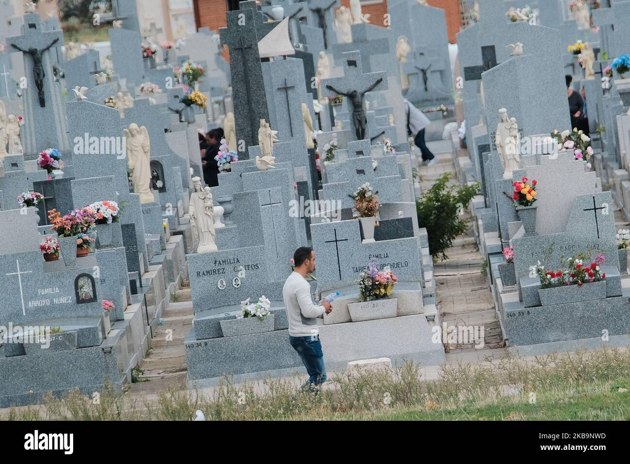 People go to the cemeteries to clean the graves and bring flowers to