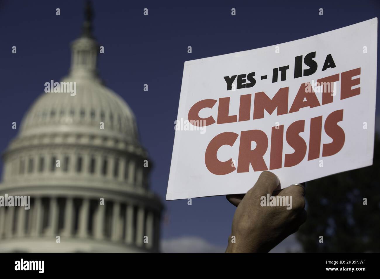 Activist holds a sign during a ''Fire Drill Fridays'' climate change protest on Capitol Hill in Washington, D.C., November 1, 2019. (Photo by Aurora Samperio/NurPhoto) Stock Photo