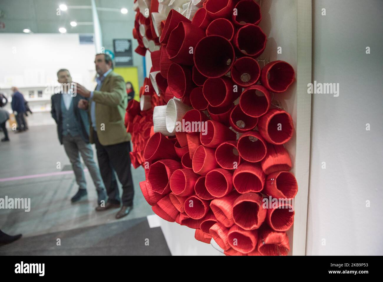Visitors admire the work of the artists during the press preview of