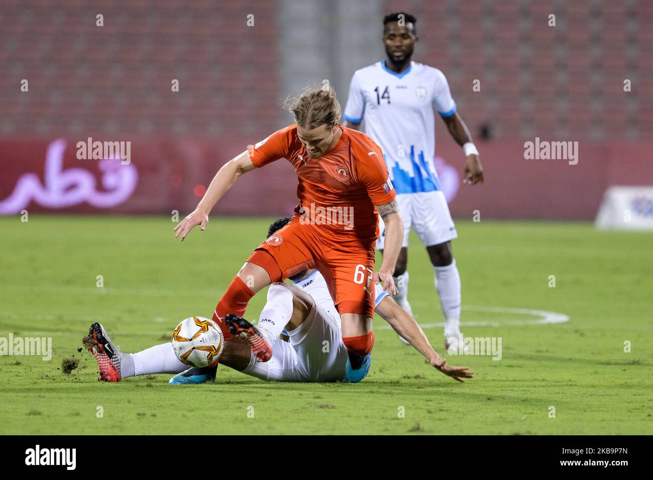 Al Arabi's Birkir Bjarnason is tackled during the QNB Stars League match against Al Wakrah on 1 November 2019 at the Grand Hamad Stadium in Doha, Qatar. (Photo by Simon Holmes/NurPhoto) Stock Photo