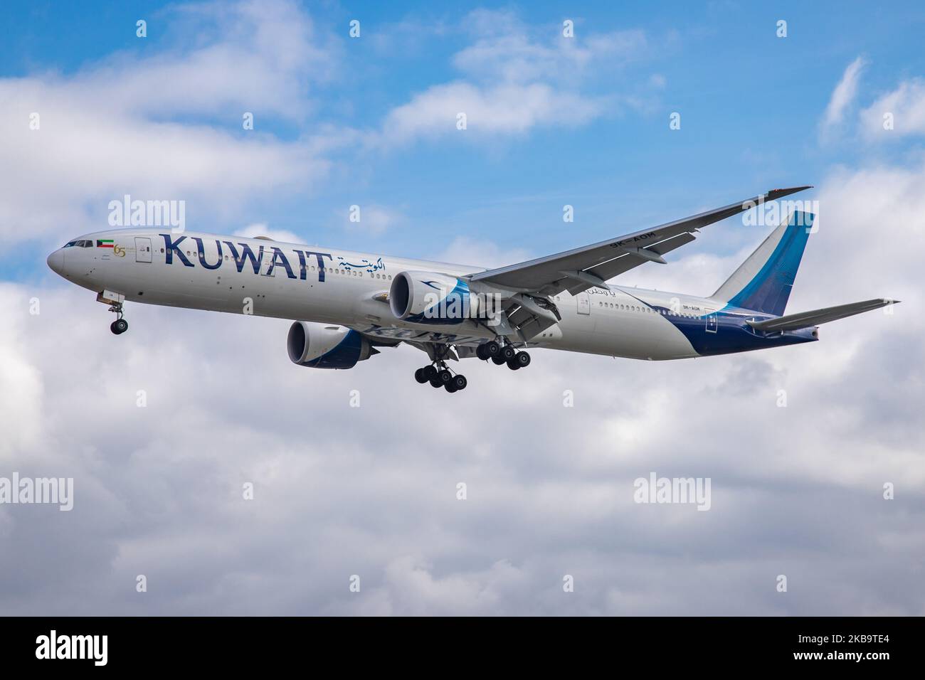 Kuwait Airways Boeing 777-300 ER aircraft as seen on final approach landing at London Heathrow International Airport LHR EGLL over the houses of Myrtle Avenue on 29 October 2019. The long-haul wide-body Boeing 777 B773 airplane has the registration 9K-AOM, the name Dasman / ????? and is powered by 2x GE jet engines. Kuwait Airways KU KAC is the national airline carrier of Kuwait and connects the British capital to Kuwait Int. Airport KWI OKBK, Kuwait City. London Heathrow Airport, England, United Kingdom (Photo by Nicolas Economou/NurPhoto) Stock Photo