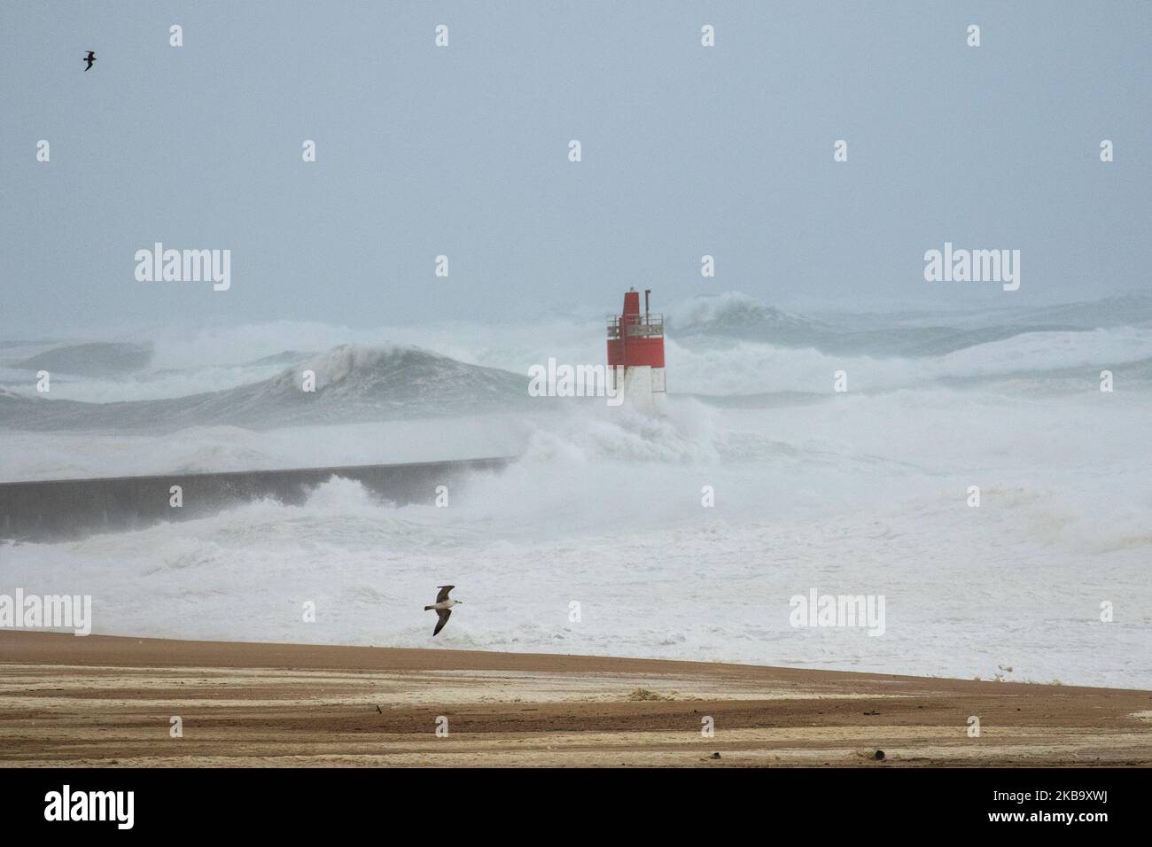 Waves break over the lighthouse in Capbreton near the ocean on November 3, 2019 during the Amelie storm. Some 100,000 households were deprived of electricity in south western France, where the Atlantic coast was swept by storm Amelie, causing damage but no casualties, according to an initial assessment by the emergency services and the prefectures. (Photo by Jerome Gilles/NurPhoto) Stock Photo