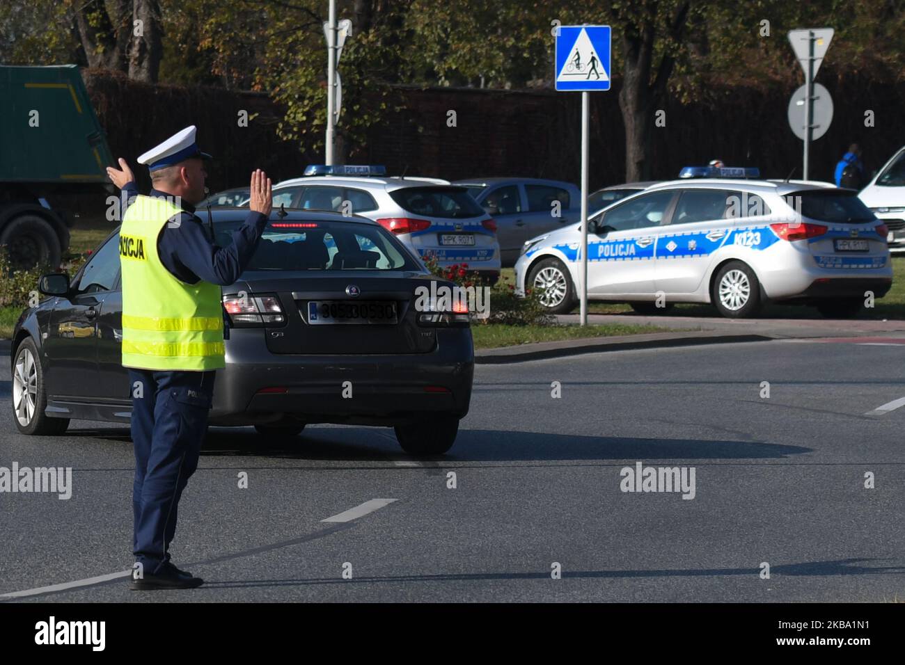 A member of Rzeszow Police managing traffic near Pobitno cemetary. Today, Polish Police Headquarters announced stats for this year's 'Candle 2019 Action' (Polish: Akcja Znicz) - an annual campaign organized during All Saints' Day weekend. 268 road accidents occurred in Poland (31 Oct to 3 Nov). 25 people were killed, 346 wounded, and 1,245 drunk drivers were detained. The number of accidents compared to the same period in 2018 fell by 99. In addition, a year ago there were 23 more casualties and 116 more injuries. However, the number of drunk drivers increased by 205 more. On Monday, 4 Novembe Stock Photo