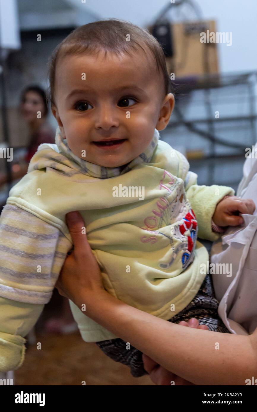 A toddler plays family bakery in Martakert in Nagorno Karabach (self