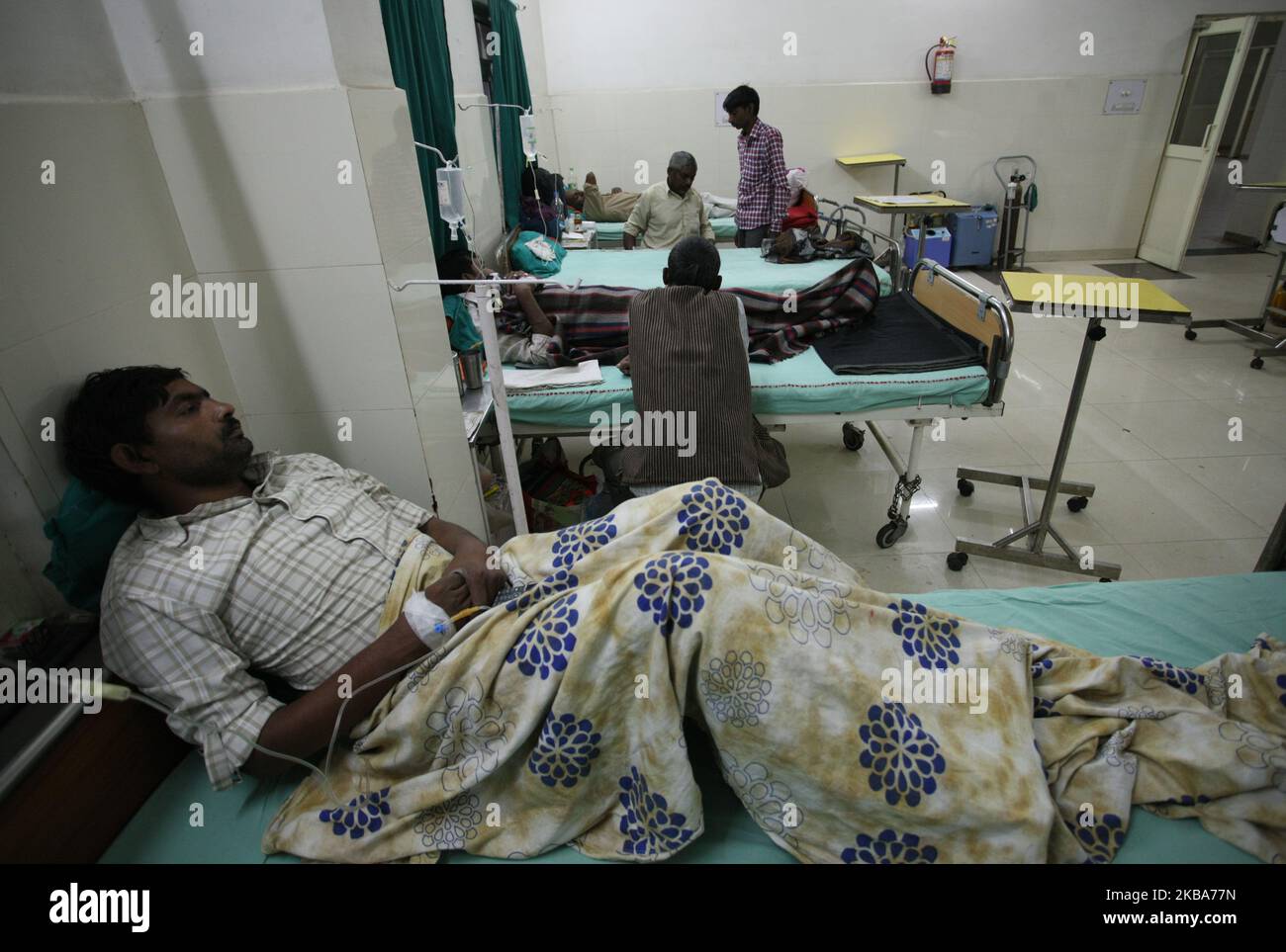 Patients suffering from Dengue fever , admitted in dengue ward of a Government Hospital , in Allahabad on November 6, 2019 . Dengue fever is considered the fastest-growing mosquito-borne disease in the world by the World Health Organization Across India. (Photo by Ritesh Shukla/NurPhoto) Stock Photo