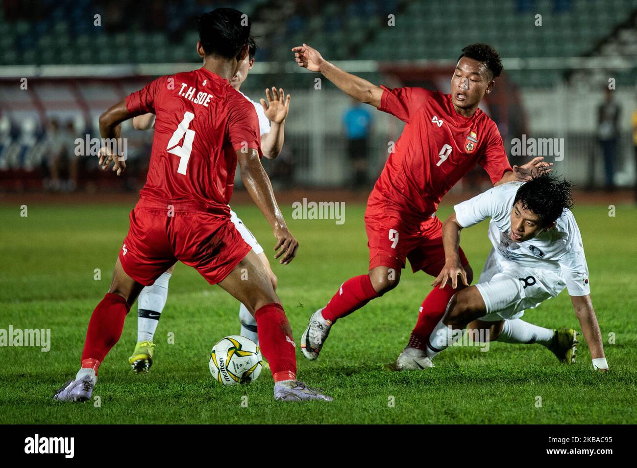 Kwon Hyeokkyu of Korea Repulbic fights for the ball against Thet Hein Soe and La Min Htwe of Myanmar during AFC U-19 Championship 2020 qualifiers football match between Korea Repulbic and Myanmar in Yangon, Myanmar on 08 November 2019. (Photo by Shwe Paw Mya Tin/NurPhoto) Stock Photo